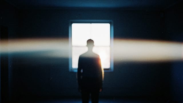 An anamorphic lens flare across a simple scene